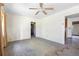 A living room with ceiling fan and multiple access points needing renovation at 321 Beard Rd, Winter Garden, FL 34787