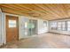 Living room with sliding glass door, wood ceiling and natural light offering a spacious and adaptable area at 321 Beard Rd, Winter Garden, FL 34787