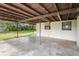 Covered patio providing an outdoor space for relaxation, overlooking the backyard at 321 Beard Rd, Winter Garden, FL 34787