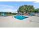 A neighborhood pool, with lounge chairs and a playground, provides a community gathering space at 335 Oakpark Loop, Davenport, FL 33837