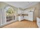 Charming kitchen with a large window overlooking the yard, providing lots of natural light at 335 Oakpark Loop, Davenport, FL 33837