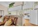 Cozy kitchen with white appliances and a view into the living area, offering a welcoming atmosphere at 335 Oakpark Loop, Davenport, FL 33837