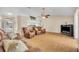 Large living room with hardwood floors, vaulted ceiling, and sliding door access at 335 Oakpark Loop, Davenport, FL 33837