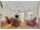 Open living room features hardwood floors and sliding doors to outdoor pool at 335 Oakpark Loop, Davenport, FL 33837