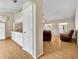 Bright living room with hardwood floors adjacent to kitchen at 335 Oakpark Loop, Davenport, FL 33837