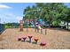 Exterior of a neighborhood playground with colorful equipment on a wood chip surface, perfect for  at 335 Oakpark Loop, Davenport, FL 33837