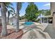 Backyard pool with a spacious patio area, tropical landscaping, and an outdoor shed, perfect for relaxation at 335 Oakpark Loop, Davenport, FL 33837