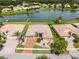 Aerial view of a single-Gathering home featuring a tile roof and brick driveway at 3533 Somerset Cir, Kissimmee, FL 34746