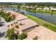 An aerial view shows a single Gathering home along a waterfront community at 3533 Somerset Cir, Kissimmee, FL 34746