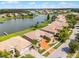 Aerial view showcases lush landscaping, tile roof, and brick driveway at 3533 Somerset Cir, Kissimmee, FL 34746