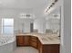 Bright bathroom featuring a glass shower, tub, and vanity with a marble countertop at 3533 Somerset Cir, Kissimmee, FL 34746