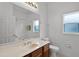 Bright bathroom featuring a single vanity and a shower-tub combo at 3533 Somerset Cir, Kissimmee, FL 34746