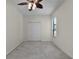 This bedroom has neutral walls, carpeted floors, closet, and a window at 3533 Somerset Cir, Kissimmee, FL 34746