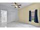 Well-lit bedroom with modern floors, closet and attached bathroom at 3533 Somerset Cir, Kissimmee, FL 34746