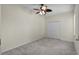 This bedroom features neutral walls, carpeted floors, and a ceiling fan at 3533 Somerset Cir, Kissimmee, FL 34746