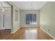 Spacious dining room with wood floors, chandelier, and natural light at 3533 Somerset Cir, Kissimmee, FL 34746