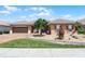 Charming single-story home with a well-manicured lawn, tiled roof, and a two-car garage at 3533 Somerset Cir, Kissimmee, FL 34746