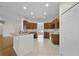 Well-equipped kitchen with wood cabinets, tile floors, and modern appliances at 3533 Somerset Cir, Kissimmee, FL 34746