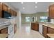 Bright kitchen with granite countertops, wood cabinetry, and views of the water at 3533 Somerset Cir, Kissimmee, FL 34746