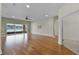 The spacious living room features wood flooring and natural light from the lake view at 3533 Somerset Cir, Kissimmee, FL 34746