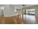 The spacious living room features wood flooring, recessed lighting, and a view of the lake at 3533 Somerset Cir, Kissimmee, FL 34746