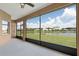 Screened-in patio offering views of the lake at 3533 Somerset Cir, Kissimmee, FL 34746