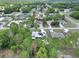 Aerial view showing the home's location in a peaceful neighborhood with tree-lined streets and well-maintained properties at 37 Pecan Pass Trl, Ocala, FL 34472