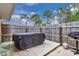 Backyard patio area features a covered hot tub and fenced yard at 37 Pecan Pass Trl, Ocala, FL 34472