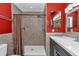 Bright bathroom with a tiled walk-in shower, modern vanity, and updated fixtures at 37 Pecan Pass Trl, Ocala, FL 34472