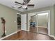 Neutral bedroom features wood-look flooring and closet with mirrored sliding doors at 37 Pecan Pass Trl, Ocala, FL 34472