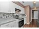Modern kitchen features stainless steel appliances, mosaic backsplash, and plenty of counter space at 37 Pecan Pass Trl, Ocala, FL 34472