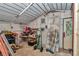 Shed interior with workbench, shelving, and ample storage space for tools and equipment at 37 Pecan Pass Trl, Ocala, FL 34472