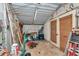 Shed interior with workbench, shelving, and ample storage space for tools and equipment at 37 Pecan Pass Trl, Ocala, FL 34472