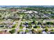 A peaceful aerial view of a neighborhood with a mix of residential homes and green spaces at 4026 Seabridge Dr, Orlando, FL 32839