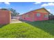 A home with a spacious, grassy backyard and a shed along the side at 4026 Seabridge Dr, Orlando, FL 32839