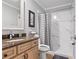 Clean and tidy bathroom featuring a shower with patterned shower curtain, vanity and tile flooring at 4026 Seabridge Dr, Orlando, FL 32839