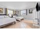 Cozy bedroom with two twin beds, neutral walls, tile flooring, and bright natural light from multiple windows at 4026 Seabridge Dr, Orlando, FL 32839