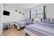 Bright bedroom featuring tile floor, two beds, and a window that offers natural light at 4026 Seabridge Dr, Orlando, FL 32839