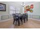 Elegant dining room with stylish decor, a modern chandelier, and a large window with natural light at 4026 Seabridge Dr, Orlando, FL 32839