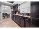 Modern kitchen equipped with stainless steel appliances, granite countertops, and dark wood cabinetry at 4026 Seabridge Dr, Orlando, FL 32839