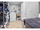 Functional laundry room featuring a washer, dryer, storage shelves, and tile flooring for easy maintenance at 4026 Seabridge Dr, Orlando, FL 32839