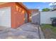 A view of the side entrance with a white garage door at 4026 Seabridge Dr, Orlando, FL 32839