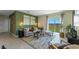 Inviting living room with a comfortable sofa, stylish decor, and sliding glass doors to the outdoor area at 4094 Giorgio Dr, Winter Haven, FL 33884