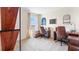 Bright home office featuring two work spaces, built in shelves, and a large window with views at 4094 Giorgio Dr, Winter Haven, FL 33884