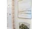 Shower features a shower head with white walls and a decorative towel nearby at 4094 Giorgio Dr, Winter Haven, FL 33884