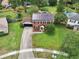 Aerial view of the house with a large yard, and neighborhood pools at 4536 Misty Morn Cir, Orlando, FL 32812