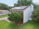 Aerial view of the house and yard with solar panels and black shutters at 4536 Misty Morn Cir, Orlando, FL 32812