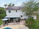 Aerial view of the property showcasing the pool, backyard, solar panels, and covered lanai at 4536 Misty Morn Cir, Orlando, FL 32812