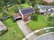 Beautiful aerial view of a brick home with solar panels and a well-manicured lawn at 4536 Misty Morn Cir, Orlando, FL 32812