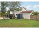 Backyard featuring a screened lanai and storage shed at 4536 Misty Morn Cir, Orlando, FL 32812